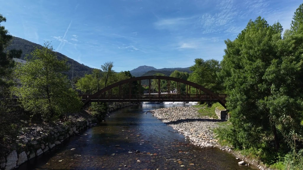 Wooden arched bridge over the river in Góis